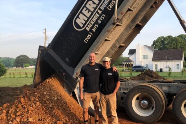 dump truck delivering dirt